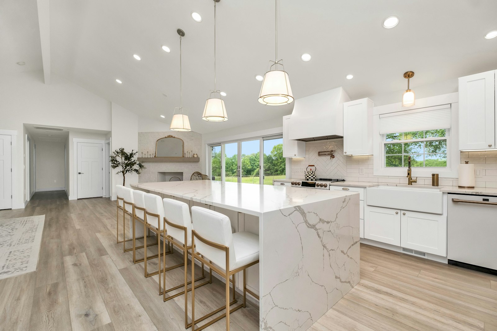 Bright open-plan kitchen with waterfall island benchtop